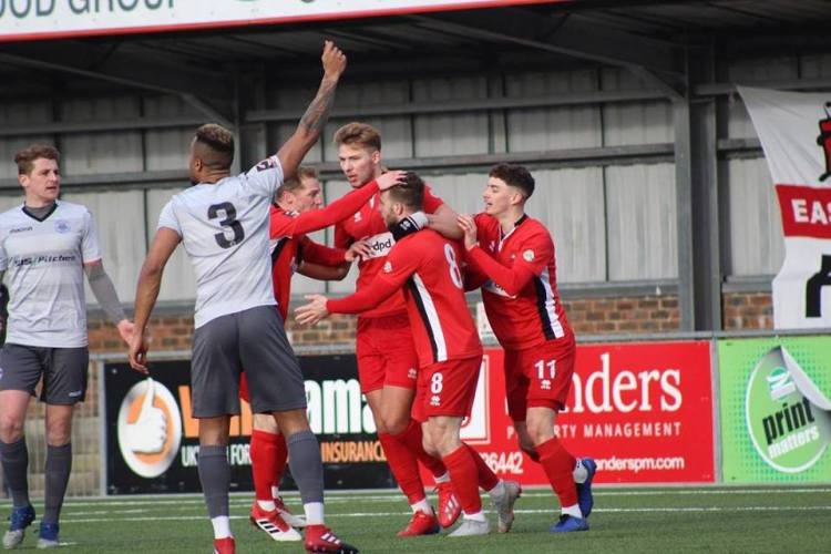 EB Ox City 2-19 Goalscorer Charlie Walker (8) celebrates his opening goal while Oxford defenders appeal in vain for offside